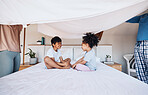 Blanket, cover and children on bed with parents for fun, play or bond in their home. Bedroom, fort and kids with mother and father waking up, games and enjoy weekend, day off or family time in house