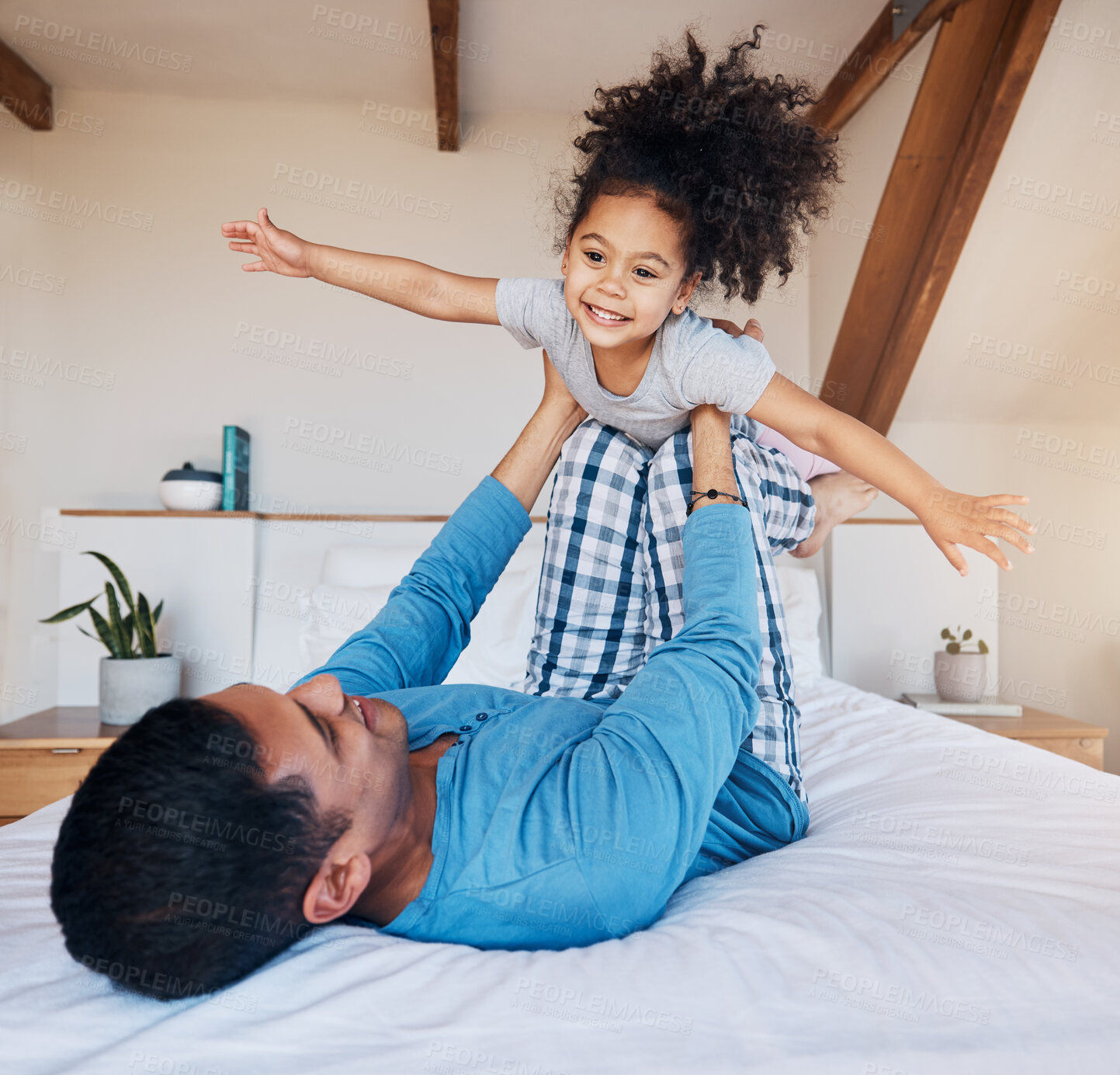 Buy stock photo Airplane, smile and girl child with father on bed flying for fun, fantasy, and happiness in modern apartment. Family, play and face of young kid with dad in bedroom for quality time and bonding