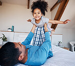 Portrait, airplane and smile of girl child with father in bedroom flying for fantasy, happiness, and fun in modern apartment. Face, love and man lifting young kid on knee in family home for play 