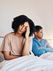 Frustrated couple, fight and headache in divorce, argument or disagreement from conflict or dispute at home. Upset woman and man in breakup, cheating affair or toxic relationship in bedroom at house