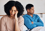 Frustrated couple, fight and headache in conflict, divorce or argument from disagreement or dispute at home. Upset woman and man in breakup, cheating affair or toxic relationship in bedroom at house