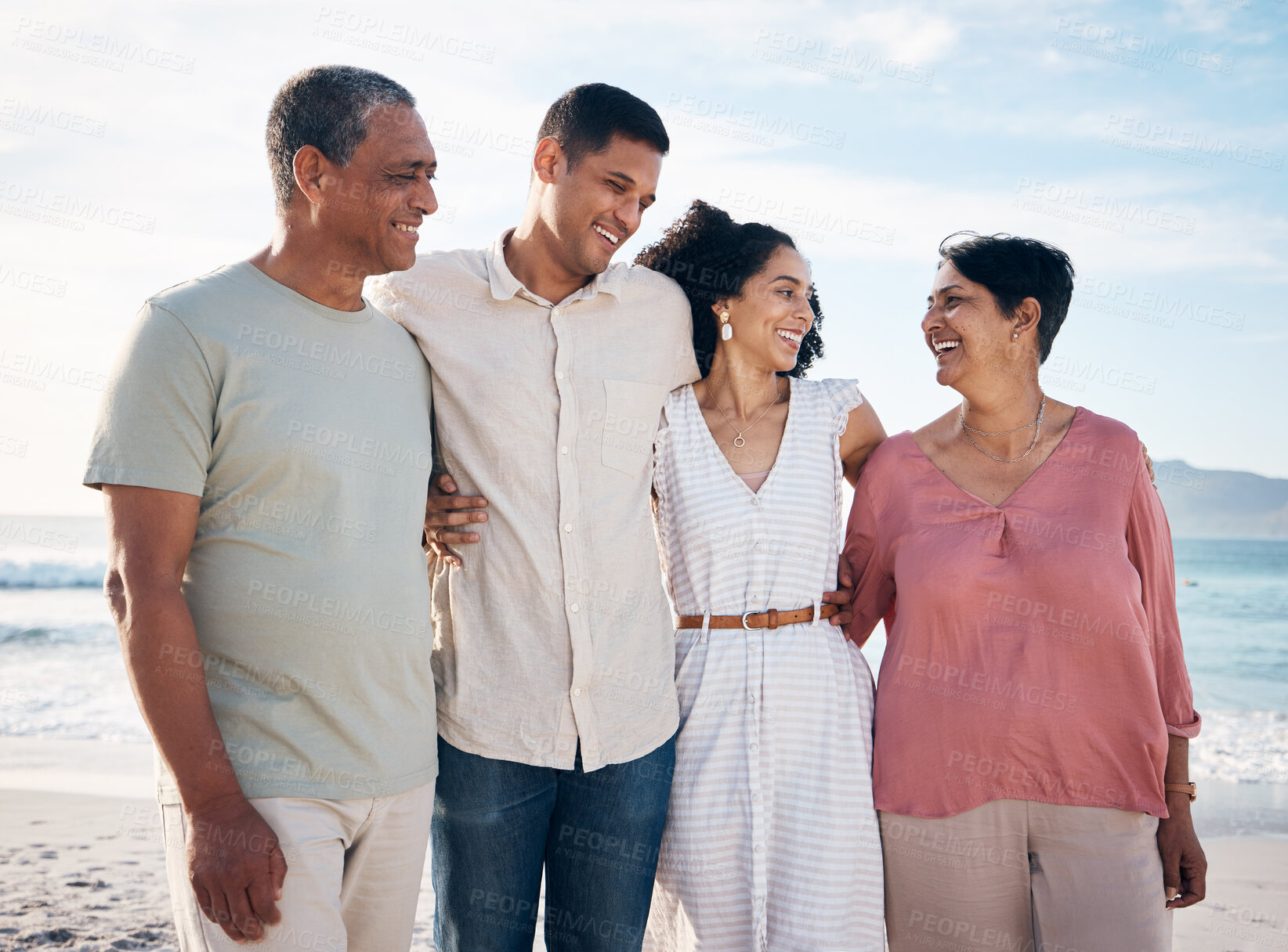 Buy stock photo Ocean, senior parents and adult children together with smile, love and hug on summer holiday in Mexico. Embrace, happy family support and mature mom, dad and couple on beach vacation travel in nature