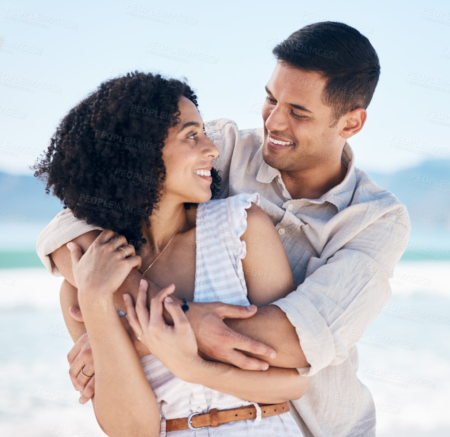 Buy stock photo Beach, hug and couple with love, holiday and romance with bonding, marriage and relationship. Romantic, man and woman embrace, seaside vacation and dating with adventure, bonding and loving together