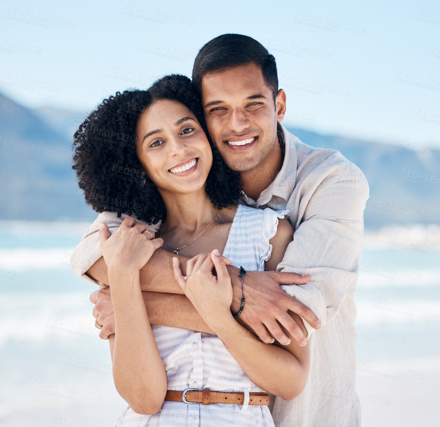 Buy stock photo Happy, couple and portrait on beach in Brazil for holiday, vacation or travel for summer break at the ocean, waves or sea. People, smile and hug on tropical adventure together for marriage or love