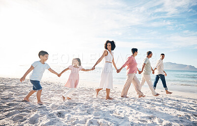 Buy stock photo Family, holding hands and outdoor at beach with love, care and happiness together in nature. Men and women or parents, grandparents and children walk, travel and playing on fun journey or holiday