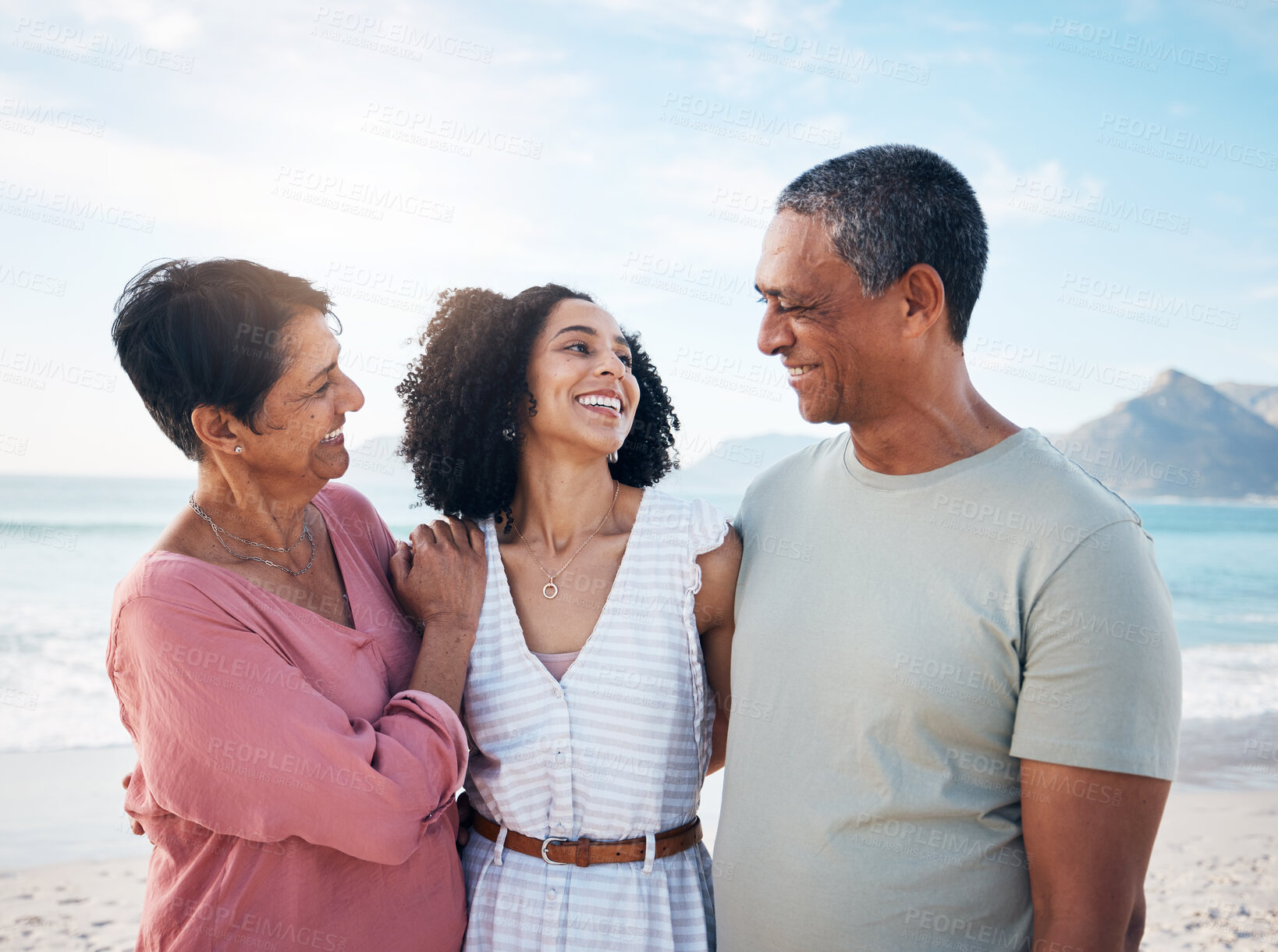 Buy stock photo Ocean, senior parents and woman together with smile, love and hug on summer holiday in Mexico. Embrace, happy family support and mature mom, dad and adult daughter on beach holiday travel in nature.