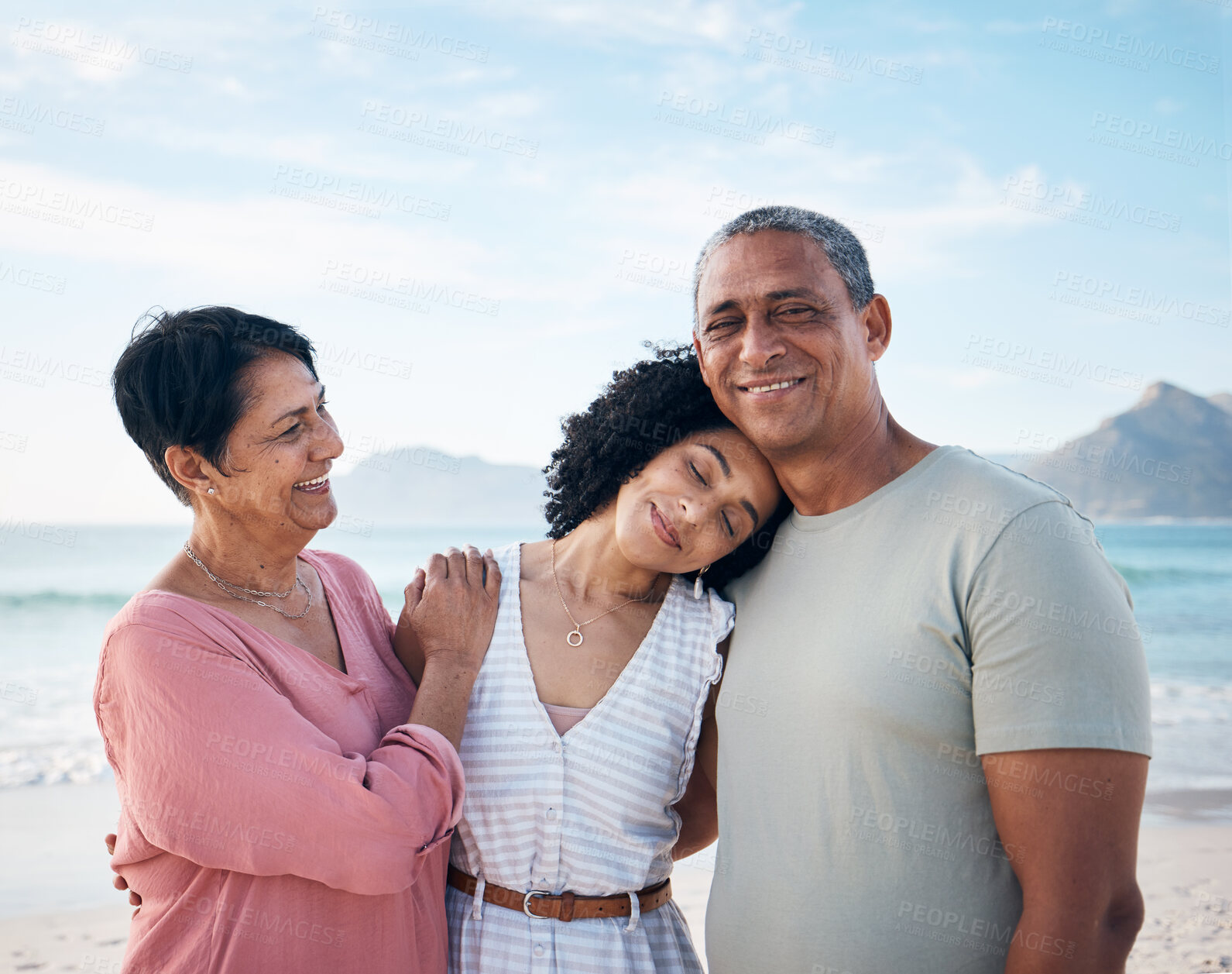 Buy stock photo Beach, senior couple and adult daughter hug together with smile, love and blue sky on summer holiday in Mexico. Embrace, happy family and mature mom, dad and woman on ocean holiday travel in nature.