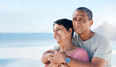 Buy stock photo Happy, mature couple and hug outdoor at beach with a smile, care and happiness together. Man and woman thinking of healthy marriage, commitment and freedom on a travel holiday with space in sky