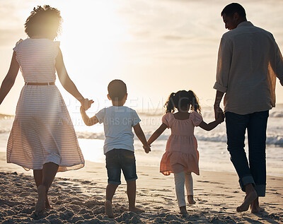 Buy stock photo Sunset, beach and back of family holding hands in nature for travel, bond and fun together. Rear view, love and children with parents at the ocean for sunrise walk, relax and enjoy freedom in Mexico