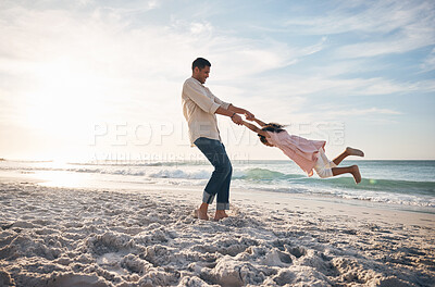 Buy stock photo Beach, swing and father with girl child at ocean for travel, fun and bond in nature together. Freedom, celebration and parent holding hands with kid at sea happy, adventure and journey on summer trip