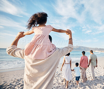 Buy stock photo Big family, holiday and walking on beach together, piggy back and holding hands on summer island sand from behind. Parents, grandparents and kids adventure on tropical vacation at ocean in Hawaii.