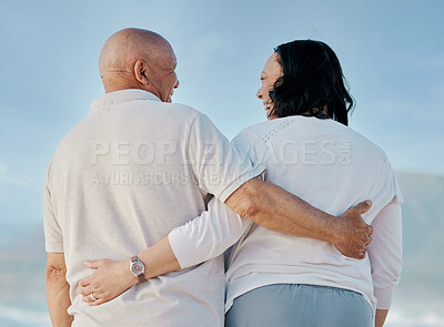 Buy stock photo Back, love and hug with old couple at beach for travel, support and summer vacation. Relax, bonding and retirement with senior man and woman on seaside holiday for trust, health and marriage together