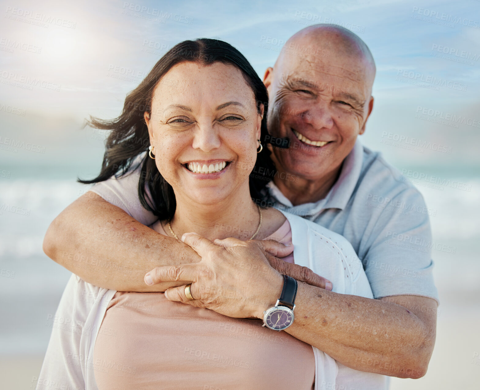 Buy stock photo Beach, portrait and senior couple hug with happy, care and freedom in nature together. Face, love and elderly man embrace woman with smile for retirement, vacation or travel fun ocean holiday in Peru