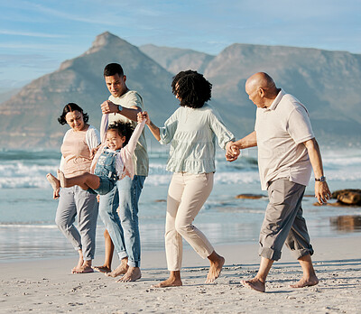 Buy stock photo Love, children and a family walking on the beach together for summer vacation or holiday in nature. Sky, freedom or travel with grandparents, parents and kids outdoor for bonding by the ocean