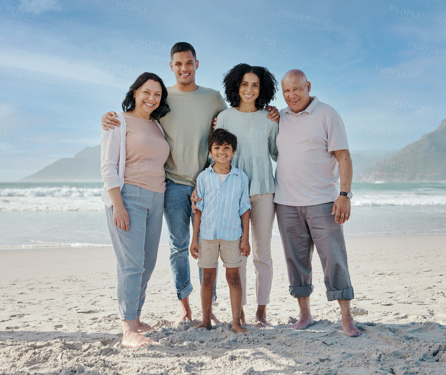 Buy stock photo Portrait, grandparents and a family on the beach in nature together for holiday or vacation by the ocean. Love, summer or freedom with parents and children at the sea for bonding or weekend travel