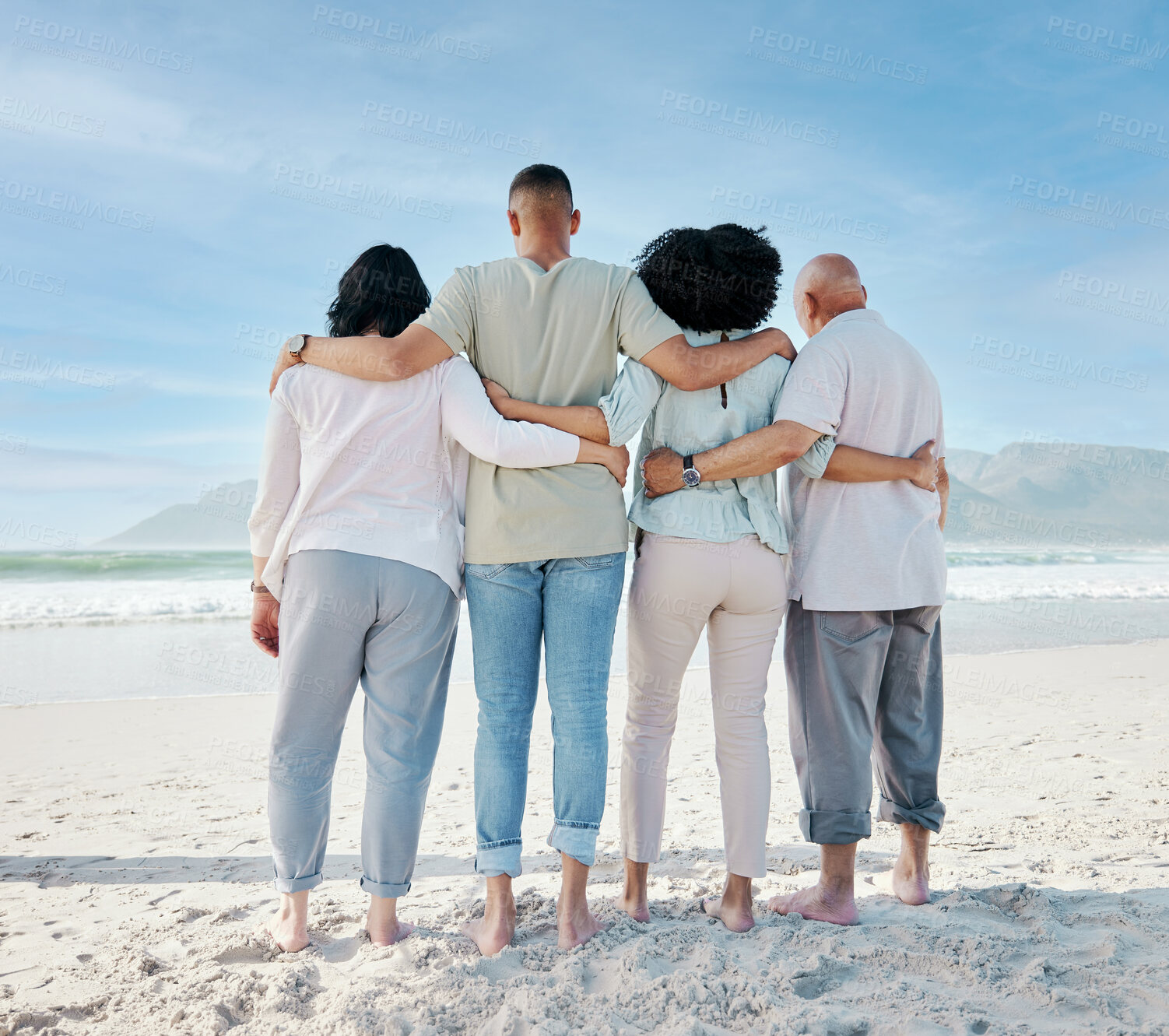 Buy stock photo Back, hug and family at the beach for vacation, ocean view and love in summer. Calm, nature and senior people with a man and woman for care and support in travel at the sea for a holiday together