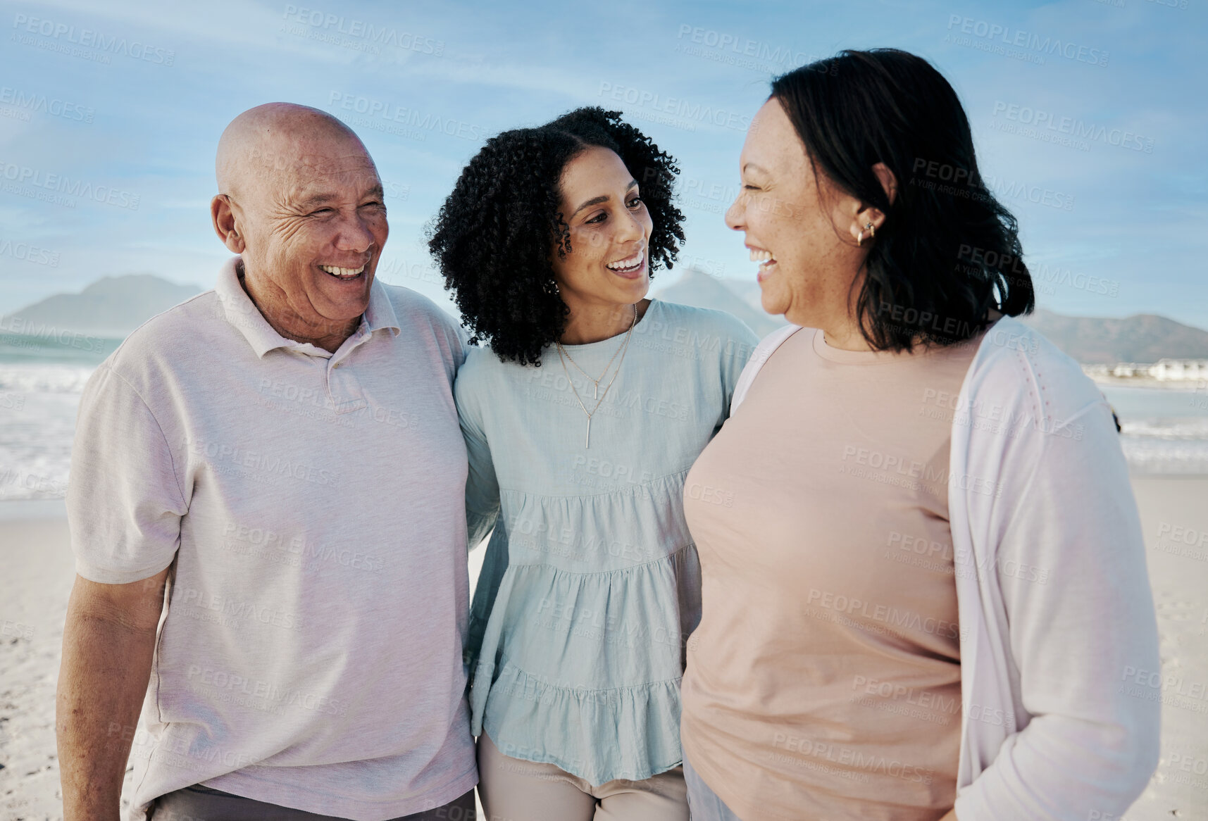 Buy stock photo Happy family, beach and woman with senior parents hug, laugh and bond in nature together. Smile, love and laughing elderly couple with adult daughter at sea for retirement, travel and visit in Cuba