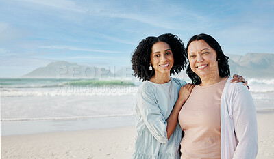 Buy stock photo Portrait, hug and woman with mother at a beach happy, bond and relax in nature together. Love, smile and lady face with mom the ocean for freedom, travel and adventure trip at the sea in South Africa