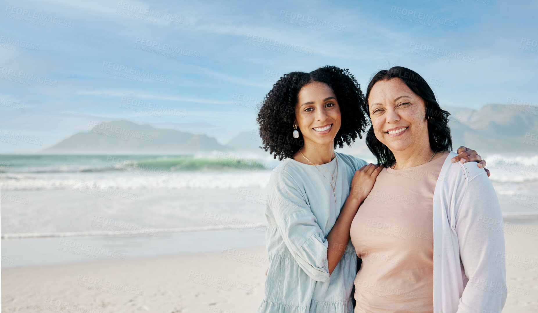 Buy stock photo Portrait, hug and woman with mother at a beach happy, bond and relax in nature together. Love, smile and lady face with mom the ocean for freedom, travel and adventure trip at the sea in South Africa