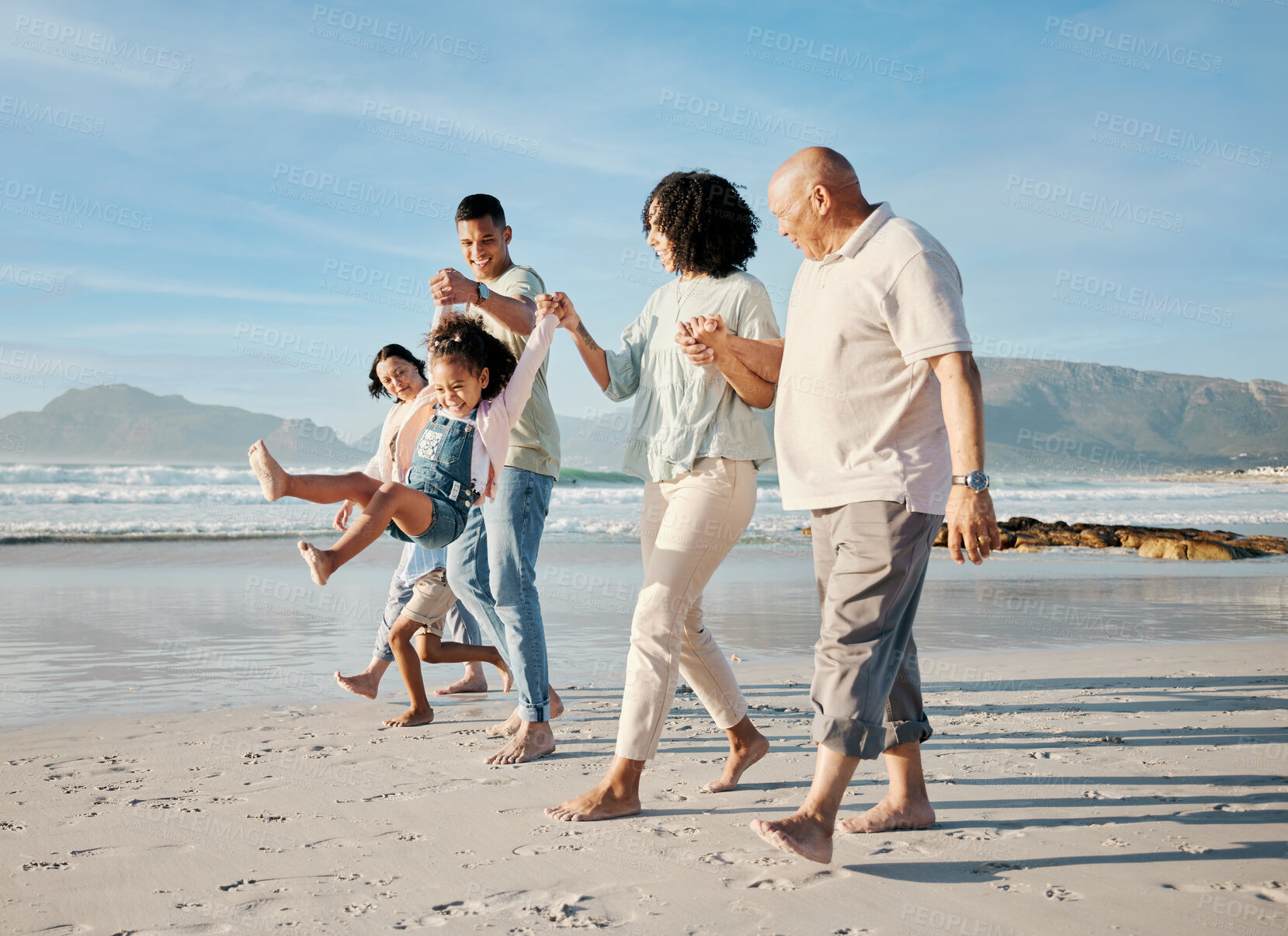 Buy stock photo Walking, holding hands and family with children on a beach with love, care and happiness on travel vacation. Parents, grandparents or men and women with kids outdoor for holiday, journey or adventure