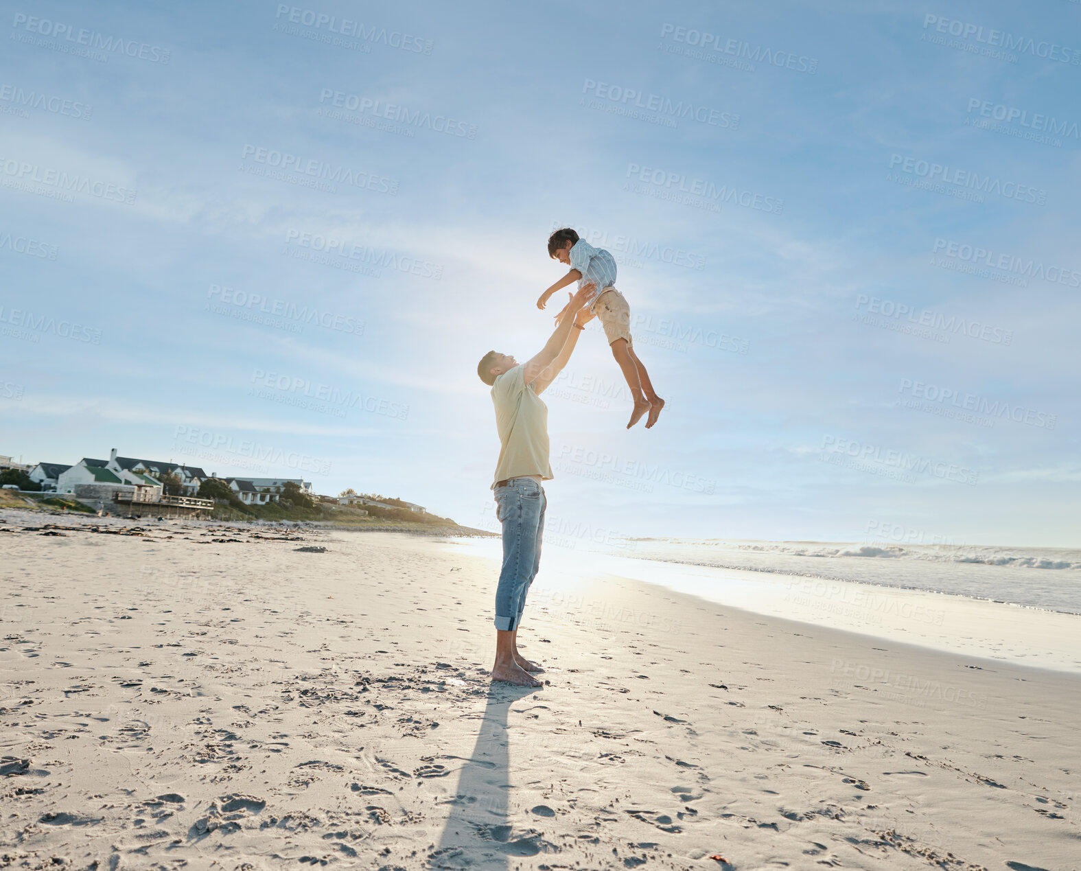 Buy stock photo Father throwing child in air on beach, sunshine and playing together in summer on tropical island holiday. Fun, dad and boy on happy ocean vacation with love, support and relax in blue sky in Hawaii.