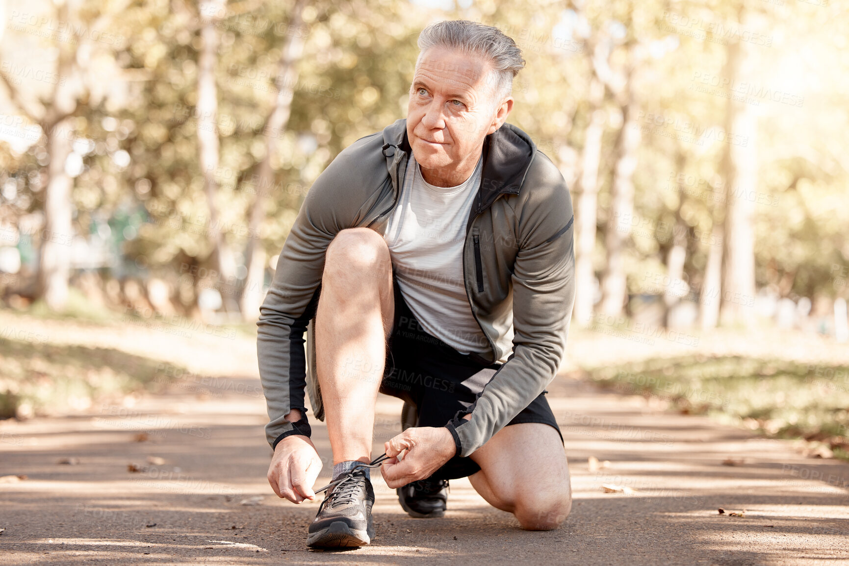 Buy stock photo Senior man, tie shoelace and running, fitness and cardio in the park, start and health, wellness and vitality. Runner is ready for exercise, athlete and sports with sneakers, path outdoor and active