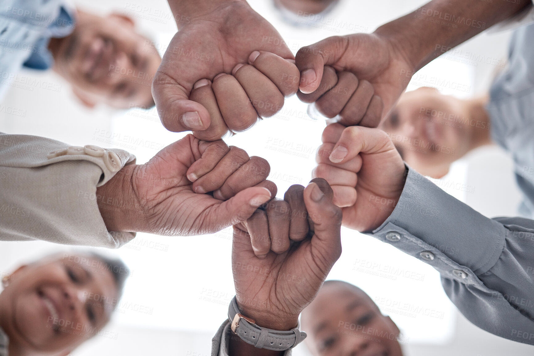 Buy stock photo Hands fist bump, group circle and team celebrate community cooperation, mission success or happy corporate achievement. Below view, goals and staff commitment, solidarity and society teamwork support