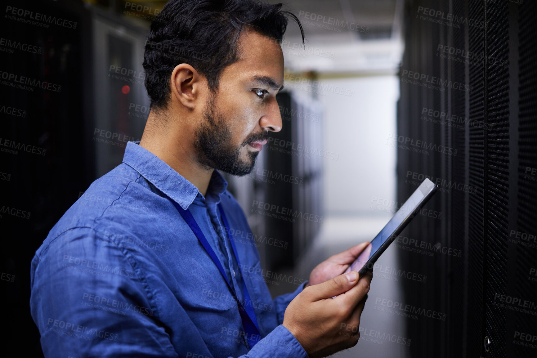 Buy stock photo Tablet, man and reading in server room of technician programming at night. Information technology, focus and engineer in data center, cybersecurity network or coding software of system admin research