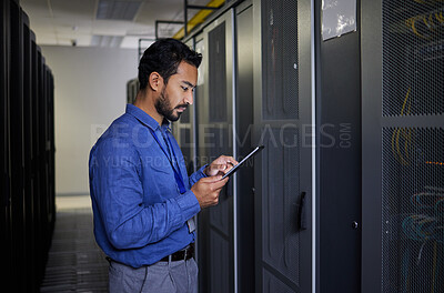 Buy stock photo Man, tablet and technician in data center, research and programming. Information technology, reading and engineer in server room, networking for maintenance and coding software of system admin typing