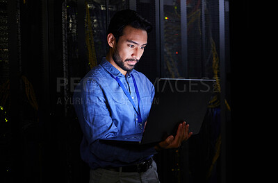 Buy stock photo Night, server room or person typing for cybersecurity glitch, machine or IT support on servers system. Data center, pc or male developer fixing network for information technology solution or research