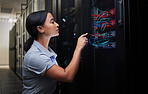 Woman, cable and engineer in server room to check inspection of cloud computing. Information technology, wire and technician in data center, networking in maintenance or cybersecurity of system admin