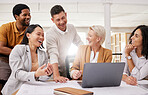 Business people, teamwork and happy on laptop for marketing meme, collaboration or funny presentation in meeting. Professional manager and group of men and women on computer with team website design