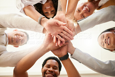 Buy stock photo Office, team building and hands together from below in huddle for teamwork, collaboration and motivation at startup. Work, goals and diversity, group of people with business growth and staff support.