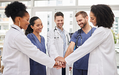 Buy stock photo Doctors, teamwork and hands together in meeting, motivation or unity in healthcare together at hospital. Happy group of medical professionals piling in team building, support or goals at the clinic