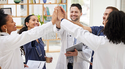 Buy stock photo Doctors, teamwork and high five in meeting, motivation or success in healthcare together at hospital. Happy group of medical professionals touching in team building, support or goals at the clinic