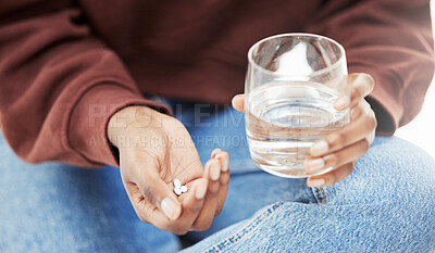 Closeup, water and woman with tablets, medicine and nutrition supplements with vitamins, care and health. Zoom, person and girl with a glass, pills and medication for virus with treatment and illness