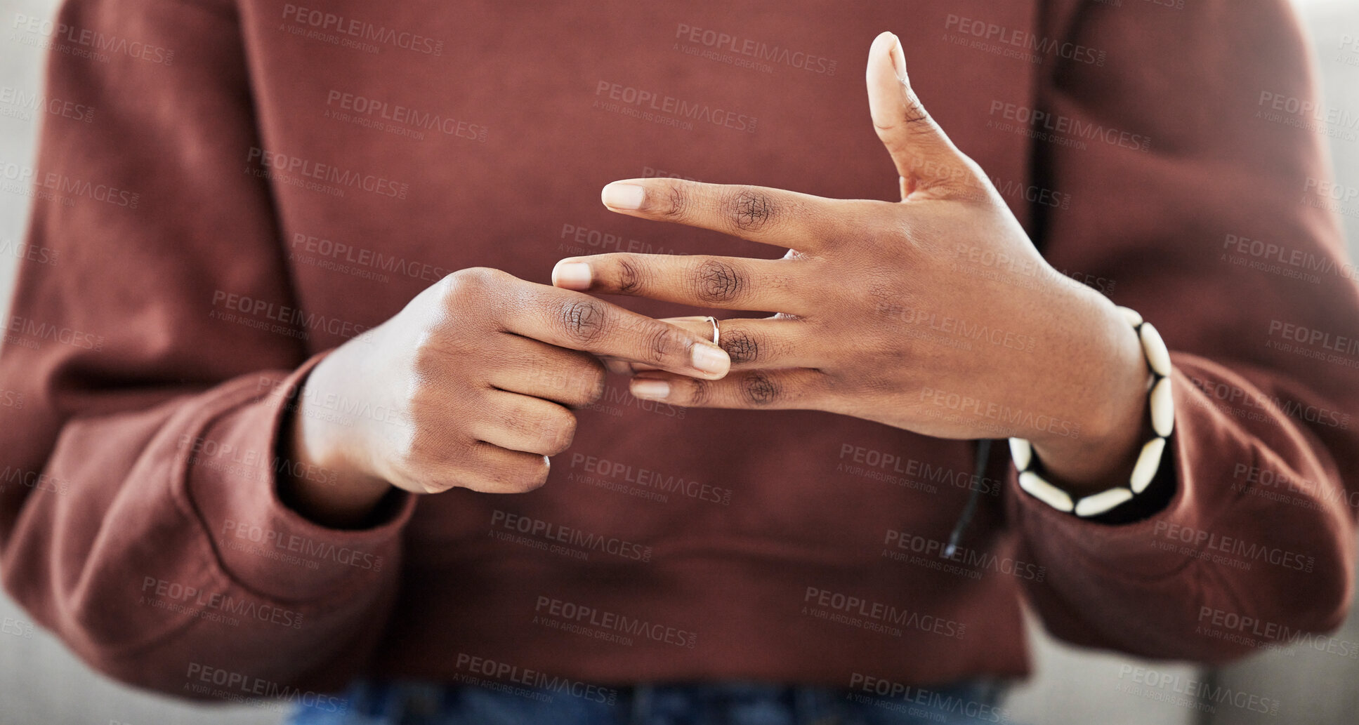 Buy stock photo Wedding ring, hands and woman with divorce, decision and relationship doubt in her home. Jewelry, finger and female with marriage anxiety, commitment or fail in living room for choice regret in house