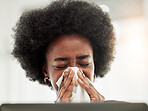 Allergies, sneeze and sick black woman blowing nose in home office with allergies, flu or cold in her home. Tissue, paper and African female freelancer with virus, hayfever or covid working on laptop