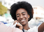 Woman, selfie and shopping bag outdoor for social media, student sale and happy portrait in city. Face of young african person or influencer smile in profile picture photography for retail or gift