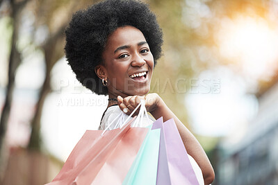 Buy stock photo Woman, shopping bag and portrait of a happy customer outdoor in a city for retail deal, sale or promotion. African person with a smile and excited about buying fashion product in urban travel space
