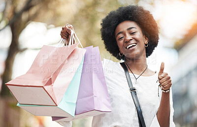 Buy stock photo Woman, shopping bag and thumbs up in city for success, thank you and support, like or yes emoji. Happy portrait of african person, winner or customer gift, competition or giveaway and ok hand or sign