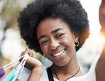Woman, selfie and shopping bag in city for social media, student sale and outdoor, happy portrait. Face of young african person or influencer smile in profile picture photography for retail or gift