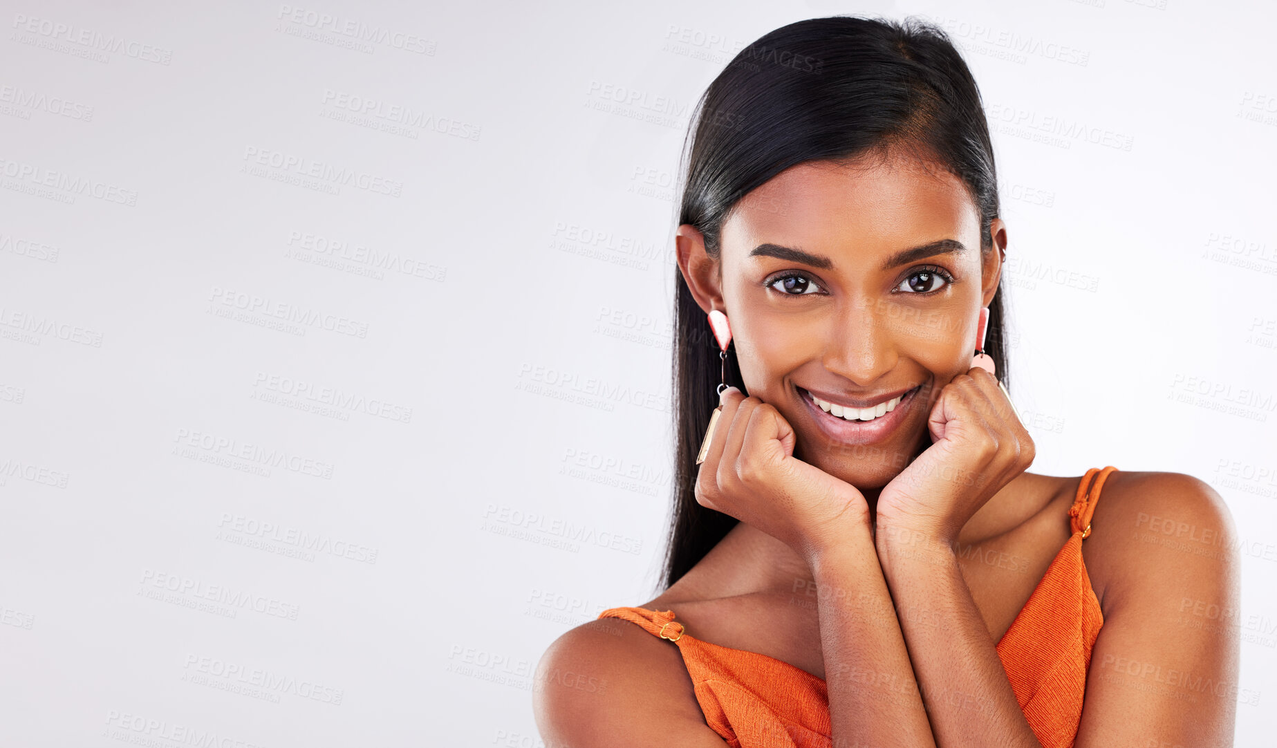 Buy stock photo Beauty, happy and portrait of Indian woman in studio with makeup, cosmetics and glamour on mockup space. Smile, aesthetic and face of person on white background with glow, wellness and confidence