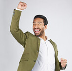 Happy asian man, fist pump and celebration in winning, success or promotion against a white studio background. Excited businessman smile in happiness for bonus, good news or victory with mockup space