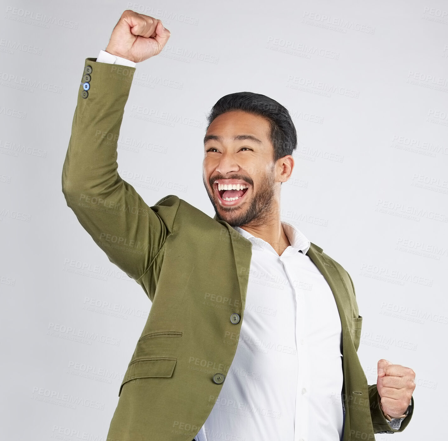 Buy stock photo Happy asian man, fist pump and celebration in winning, success or promotion against a white studio background. Excited businessman smile in happiness for bonus, good news or victory with mockup space