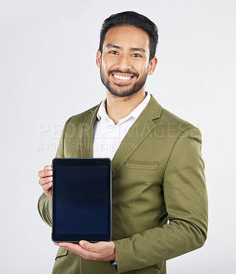 Buy stock photo Happy asian man, portrait and tablet on mockup in advertising against a white studio background. Businessman with technology display or screen in marketing, advertisement or branding on mock up space