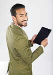 Smile, tablet and portrait of businessman with technology with internet isolated in a studio white background. Online, planning and young person or employee working on connection or networking