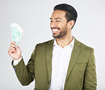 Happy asian man, money and finance in savings, investment or loan against a white studio background. Excited businessman smile and cash or dollar bills in financial freedom, profit or salary increase