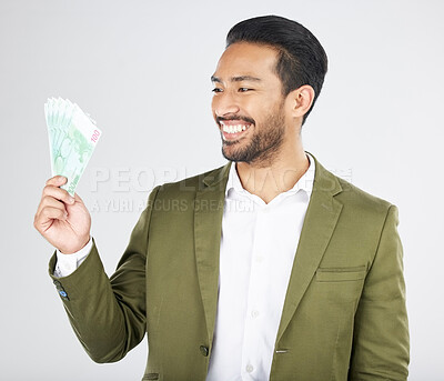 Buy stock photo Happy asian man, money and finance in savings, investment or loan against a white studio background. Excited businessman smile and cash or dollar bills in financial freedom, profit or salary increase