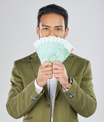 Buy stock photo Asian man, money fan and finance in savings, investment or loan against a white studio background. Portrait of businessman with cash or dollar bills in financial freedom, profit or salary increase